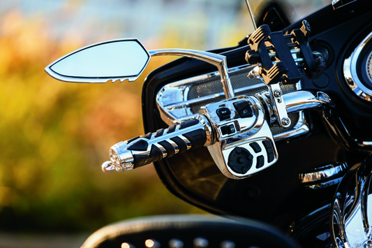 Chrome Kuryakyn raised mirror adaptors for metric motorcycle models, designed to improve mirror positioning and visibility.