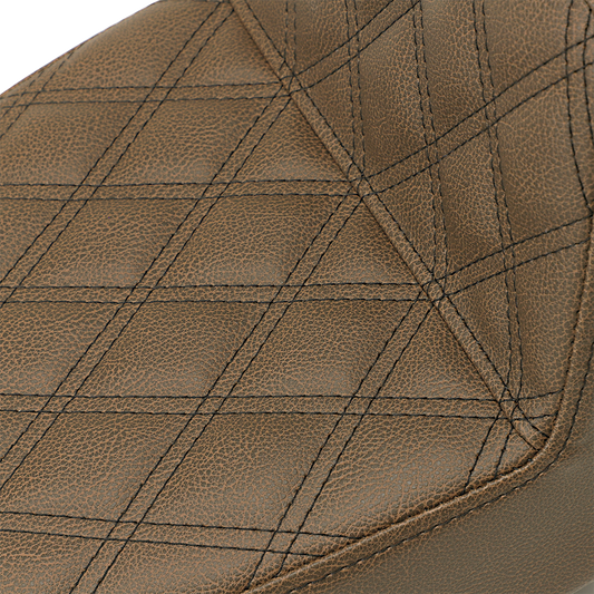 Brown SADDLEMEN Step-Up Seat with full lattice stitch for Dyna models, featuring a comfortable, textured motorcycle seat design.