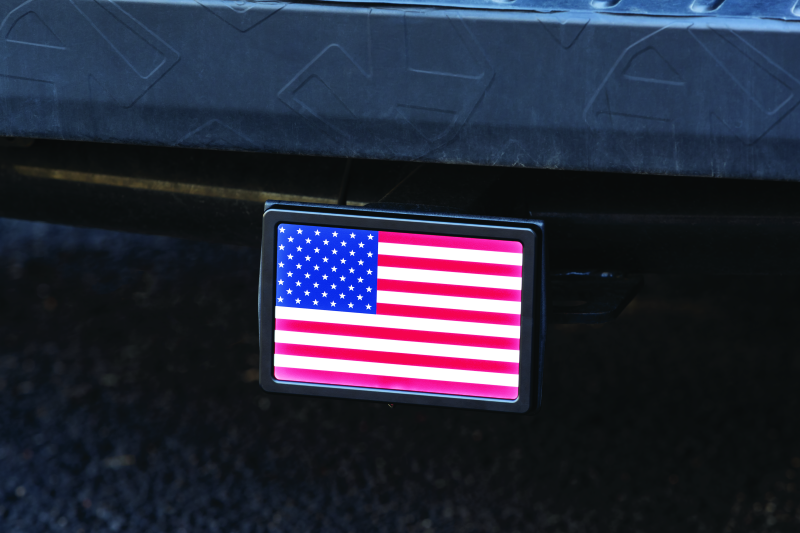 Kuryakyn Freedom Flag LED hitch cover in black for 1-1/4 inch and 2-inch receiver hitches, featuring LED illumination.