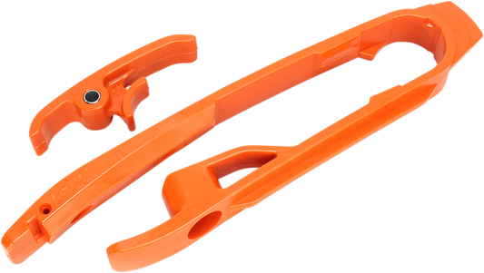 Orange Acerbis chain slider for KTM motorcycles, designed to protect the chain and sprocket from wear and damage.