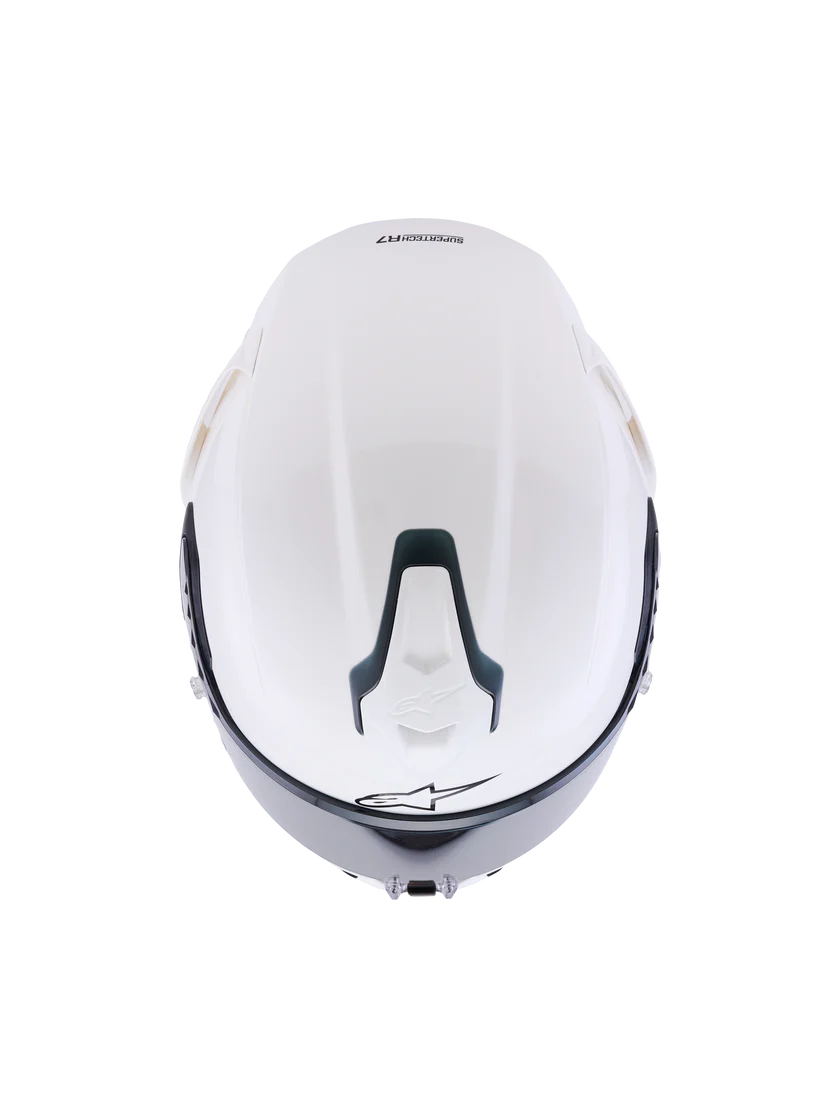 Alpinestars R7 Solid helmet with ECE 22.06 and DOT certification, showing a sleek black motorcycle helmet with ventilation vents.