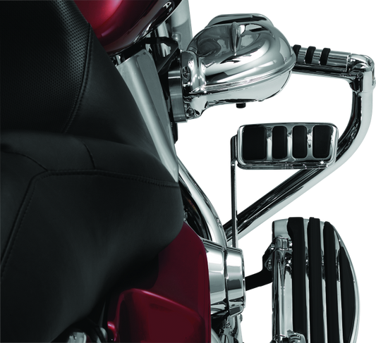 Kuryakyn ISO Brake Pedal Pad Longhorn Chrome for Harley Davidson Touring motorcycle, showing shiny chrome finish and detailed design.