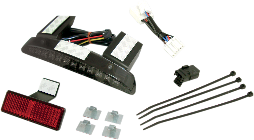 DRAG SPECIALTIES running and brake light assembly with smoke lens for motorcycle, featuring sleek black design and clear lens.