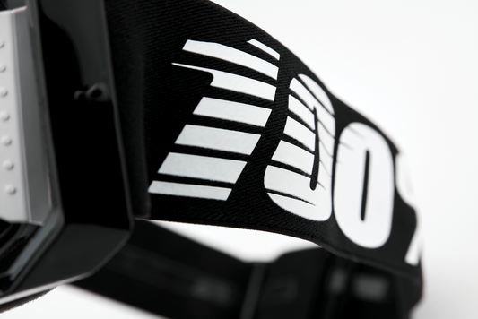 Bill's Exhausts 100% Armega goggles in black with clear lenses, featuring a sleek design for eye protection and style.
