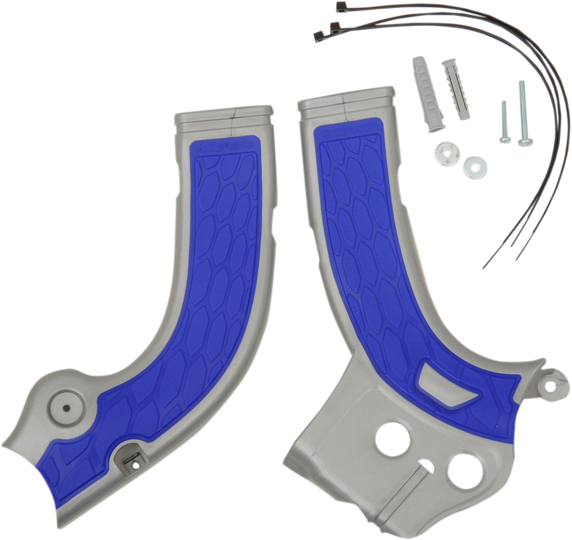 A set of ACERBIS X-Grip Frame Guards in silver and blue, designed for motorcycle body protection, shown in the image.
