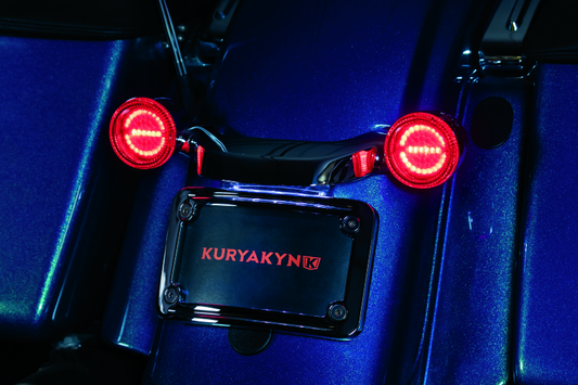 Kuryakyn Luminez LED rear turn signal insert in red for Harley-Davidson, 1157 style, with bright LED lights and clear lens.