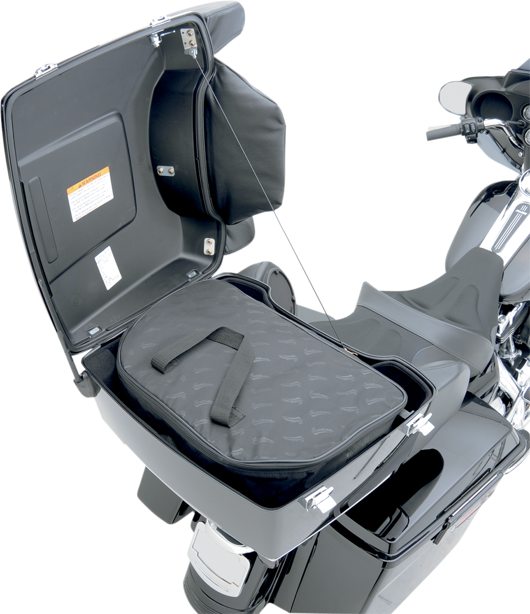 Bill's Exhausts Saddlemens Tour Pak soft liner for seats, shown installed inside a motorcycle tour pack for added comfort.