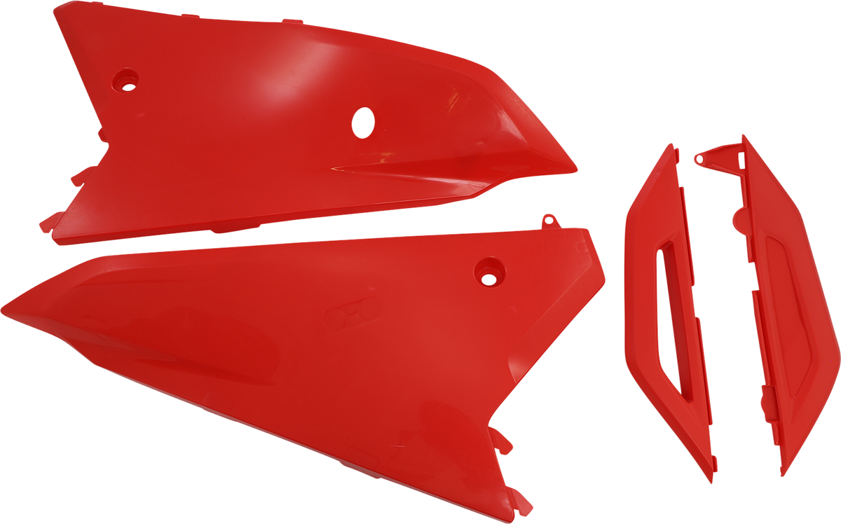 A close-up of red Acerbis side panels for a motorcycle, showcasing the body panels with the Acerbis branding.