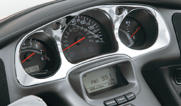 Chrome engine instrument panel accent by Bill's Exhausts, featuring a sleek chrome finish on a vehicle engine component.
