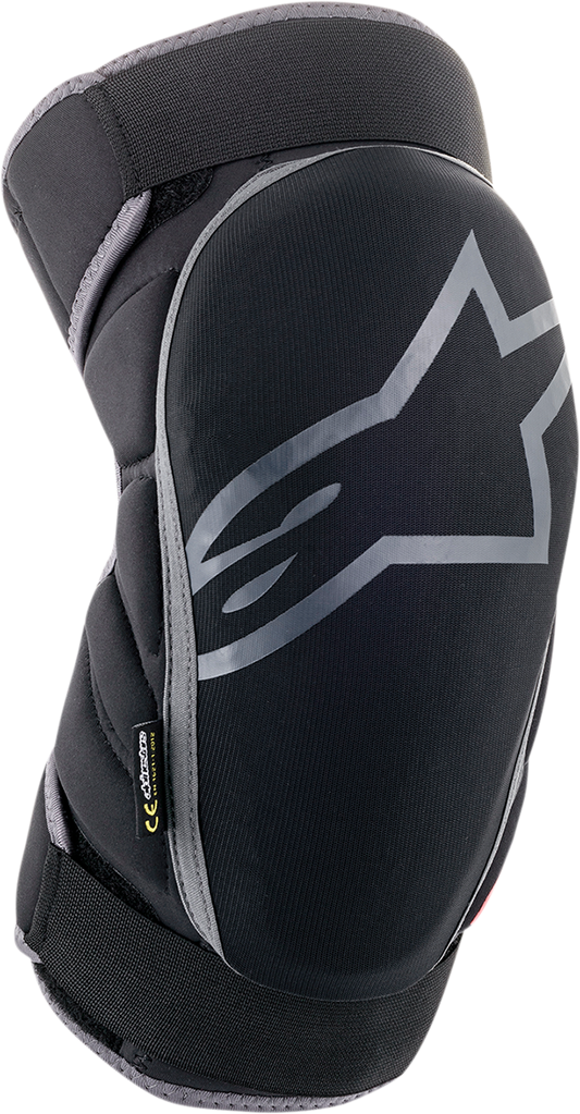 Alpinestars Vector knee guards in black, anthracite, and red, showing protective padding and adjustable straps for knee support.