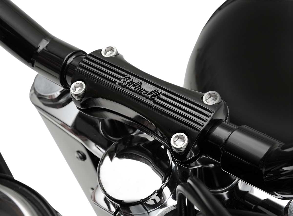 Black BILTWELL Thunder 2-inch handlebar risers for motorcycles, designed to improve riding comfort and handlebar height.