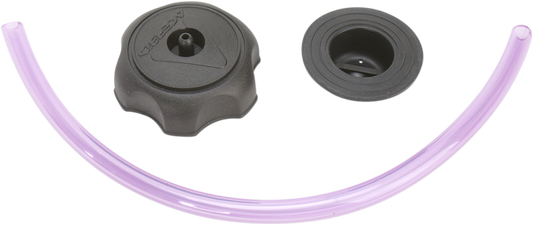 Small Acerbis gas cap for motorcycle fuel tanks, black body with metal top, designed for durability and secure fit.