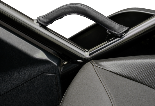 Black stitched SHOW CHROME grab handle cover for engine, designed by Bill's Exhausts, shown on a motorcycle engine.