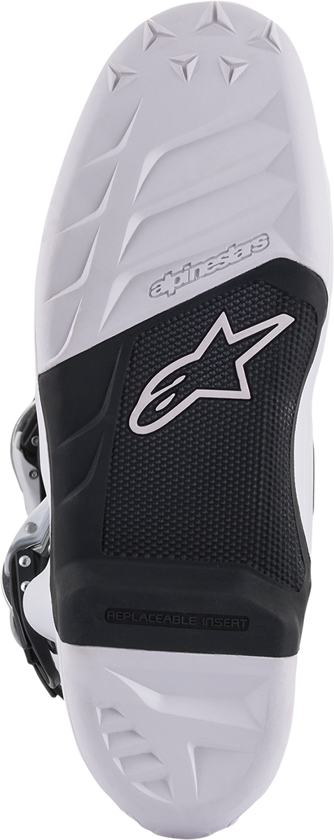 Alpinestars Tech 7 motocross boots in white and black with US size 10, featuring durable construction and adjustable straps.