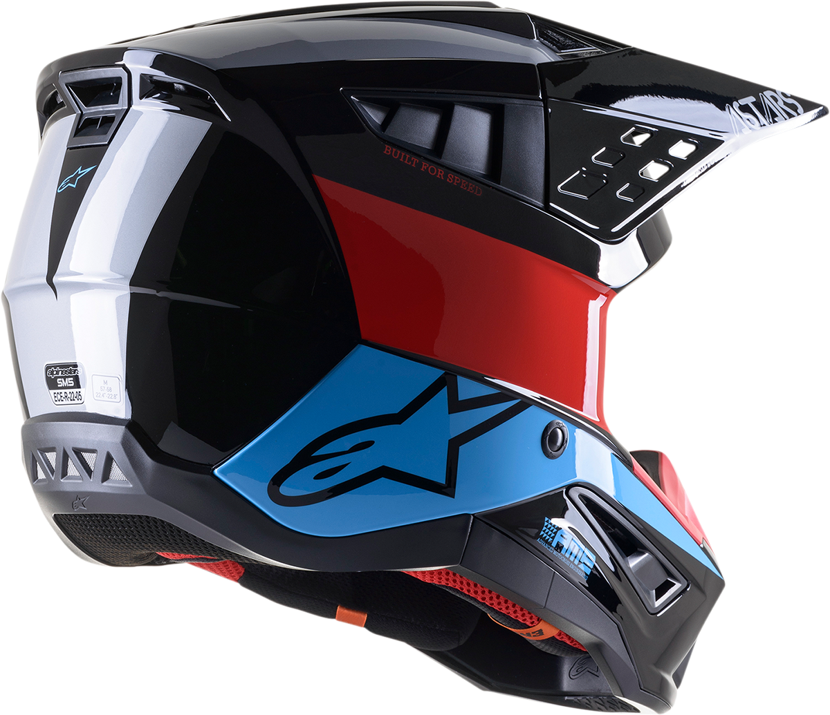 Alpinestars SM5 motorcycle helmet in black, red, and cyan with a medium size, featuring a sleek design and aerodynamic shape.