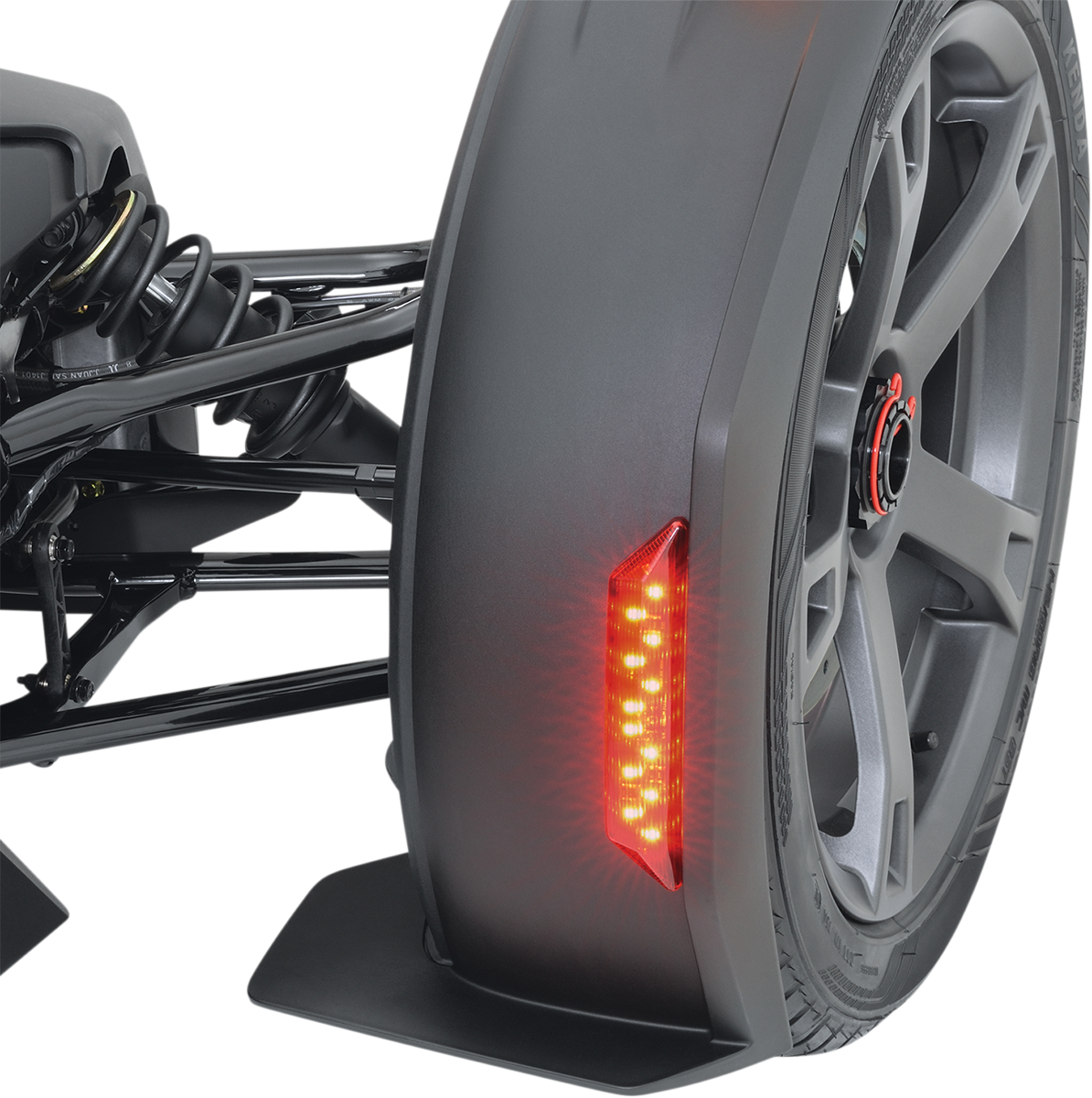 Can-Am front and rear chrome fender lights, engine components by Bill's Exhausts, shown in a detailed close-up image.