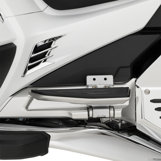 Bill's Exhausts Show Chrome Passenger Floorboard Risers for Honda GL1800 motorcycle, engine-mounted with chrome finish.