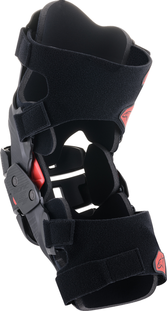 Alpinestars Youth Bionic 5S knee braces in black and red, designed for protective bionics and athletic support.
