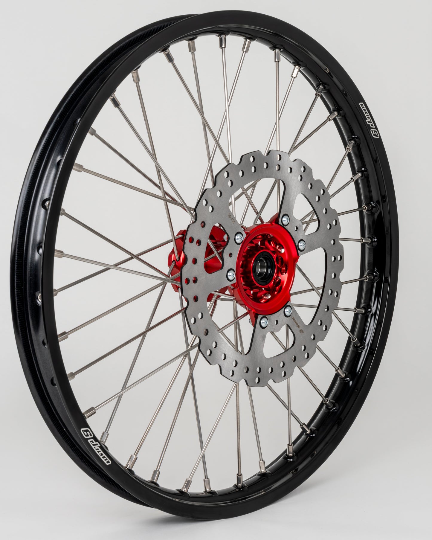 Warp9Racing Honda CR/CRF 21-inch front wheel showing spokes, rim, and hub for off-road motorcycle use.