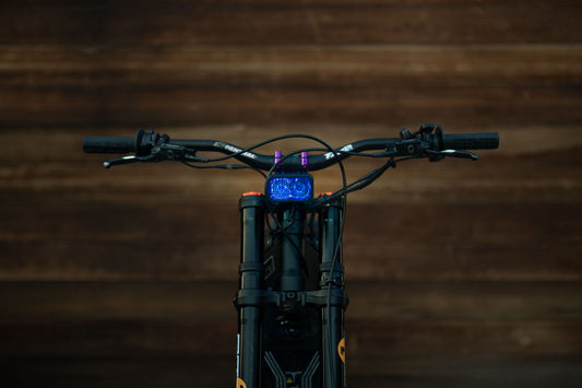 Warp9Racing V2 High-Output Headlight with W9 Mounting, showcasing durable construction and mounting hardware for optimal visibility.