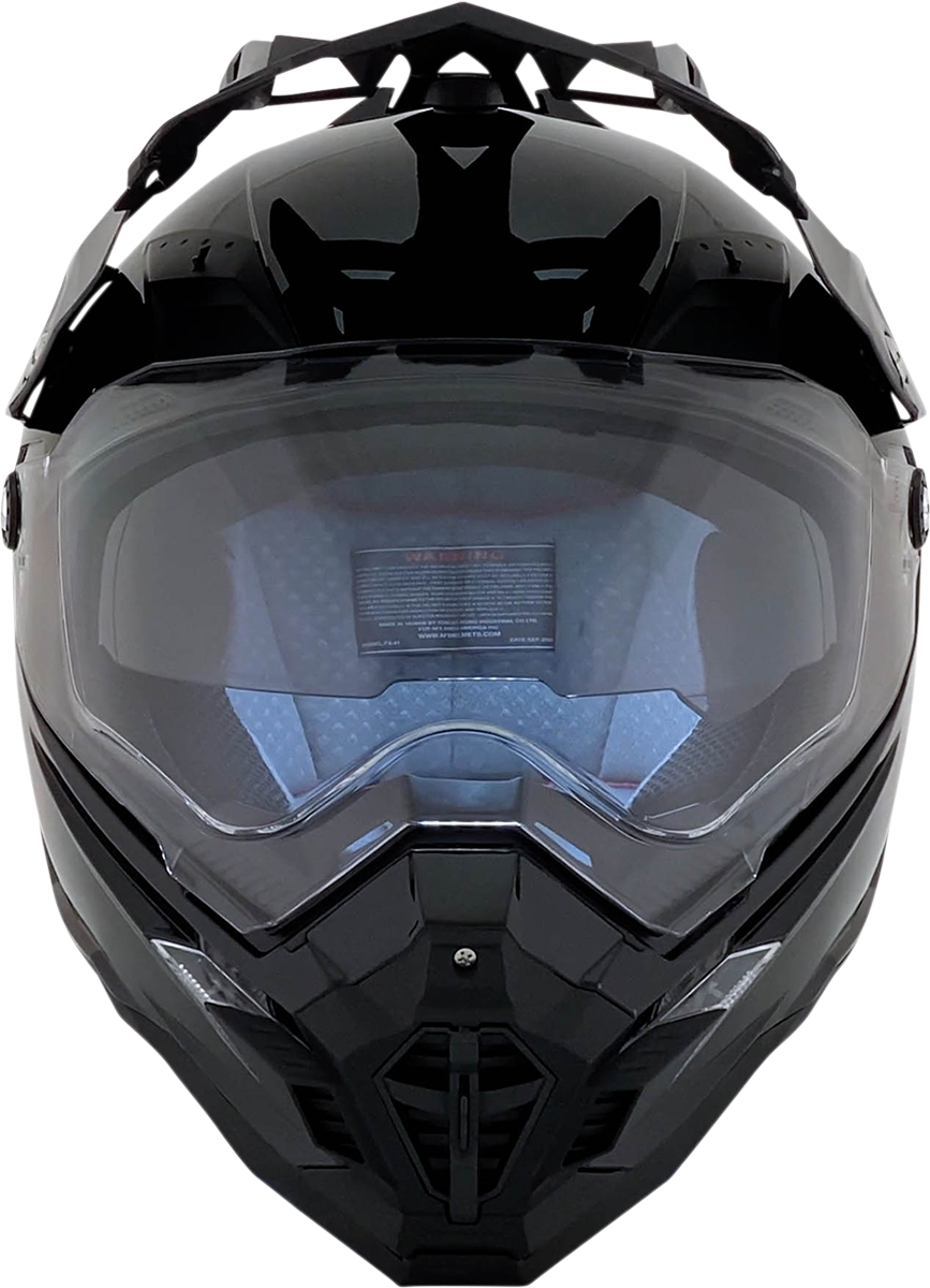 Gloss black AFX FX-41DS helmet in medium size with clear visor and aerodynamic design, featuring brand logo on the front.