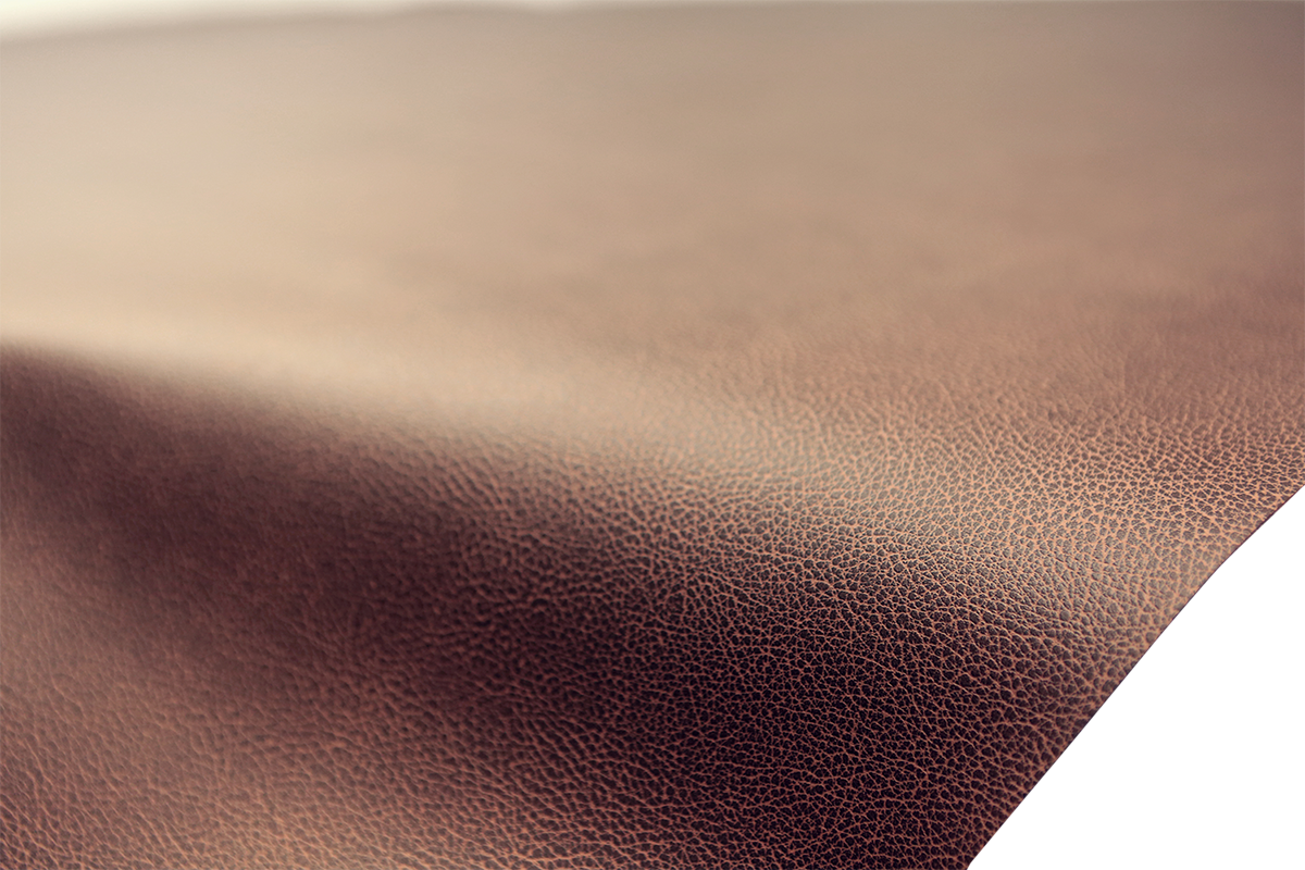 Brown SADDLEMEN Carbon Seat Cover for motorcycle seat, measuring 54x36 inches, with textured carbon design.