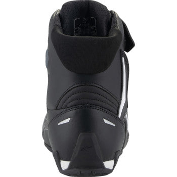 Black and white Alpinestars Faster-4 motorcycle shoes in US size 7.5, featuring sporty design and durable construction.