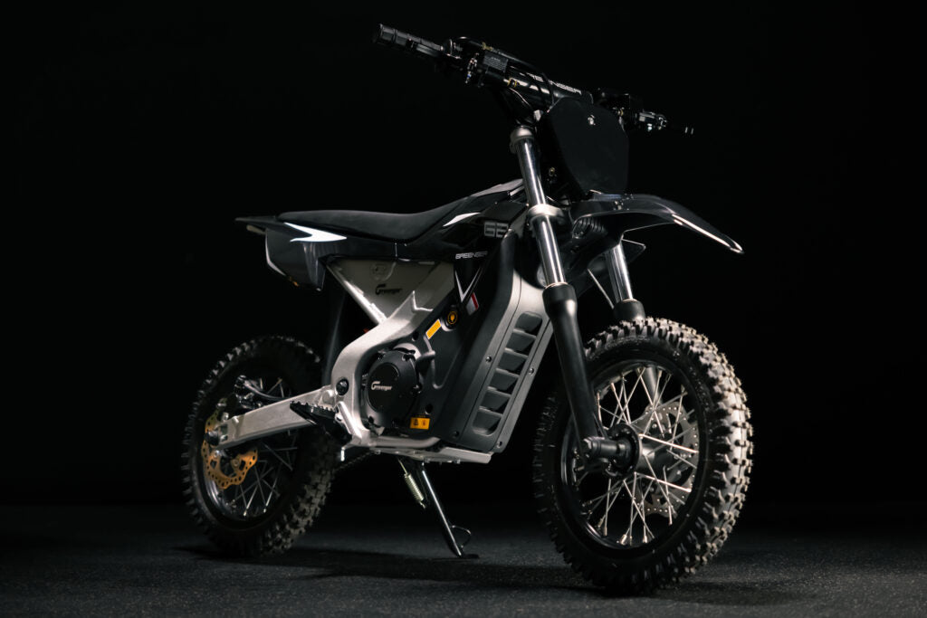 Greenger G2 electric dirt bike for kids, 50cc equivalent, with red frame, handlebars, and off-road tires for outdoor riding.