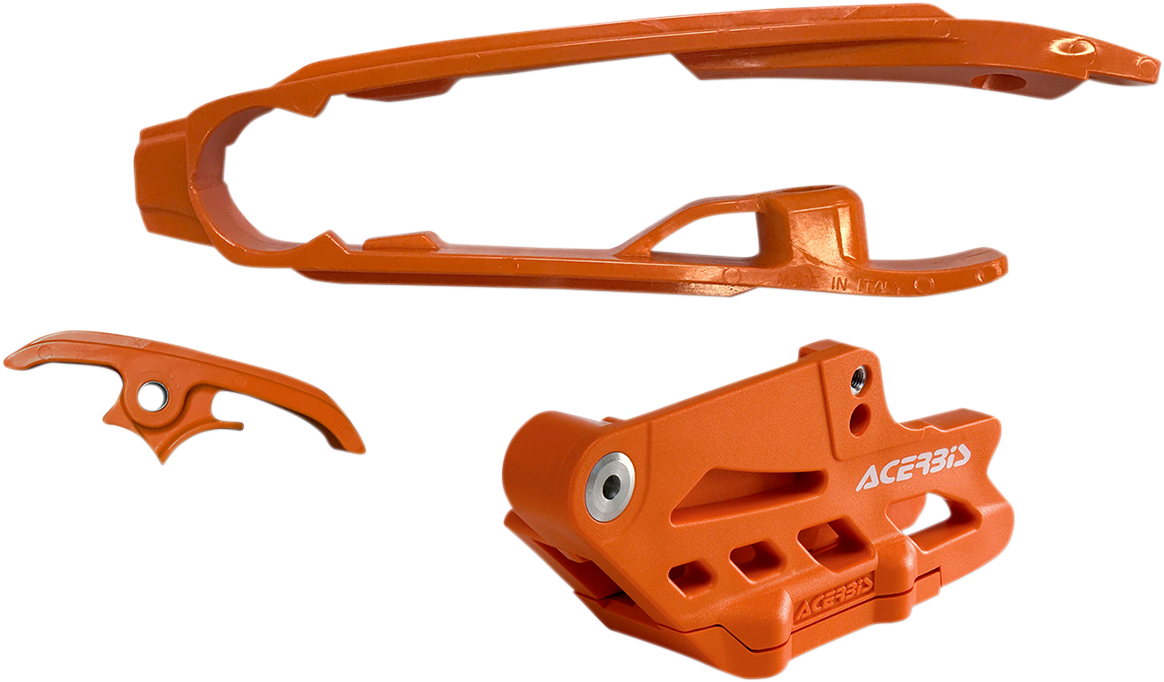 A bright orange Acerbis Chain Guide 2.0 and Slider Kit for Husqvarna, KTM, and Gas Gas bikes, mounted on a motorcycle frame.