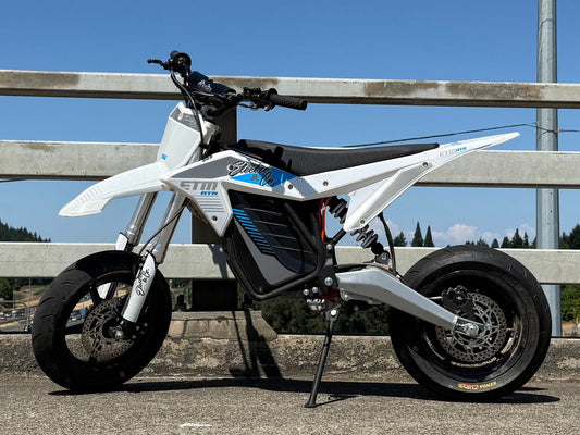 Electro & Co ETM RTR 12-inch mag wheel set with Kenda tires, rotor, sprocket, and chain on a white background.