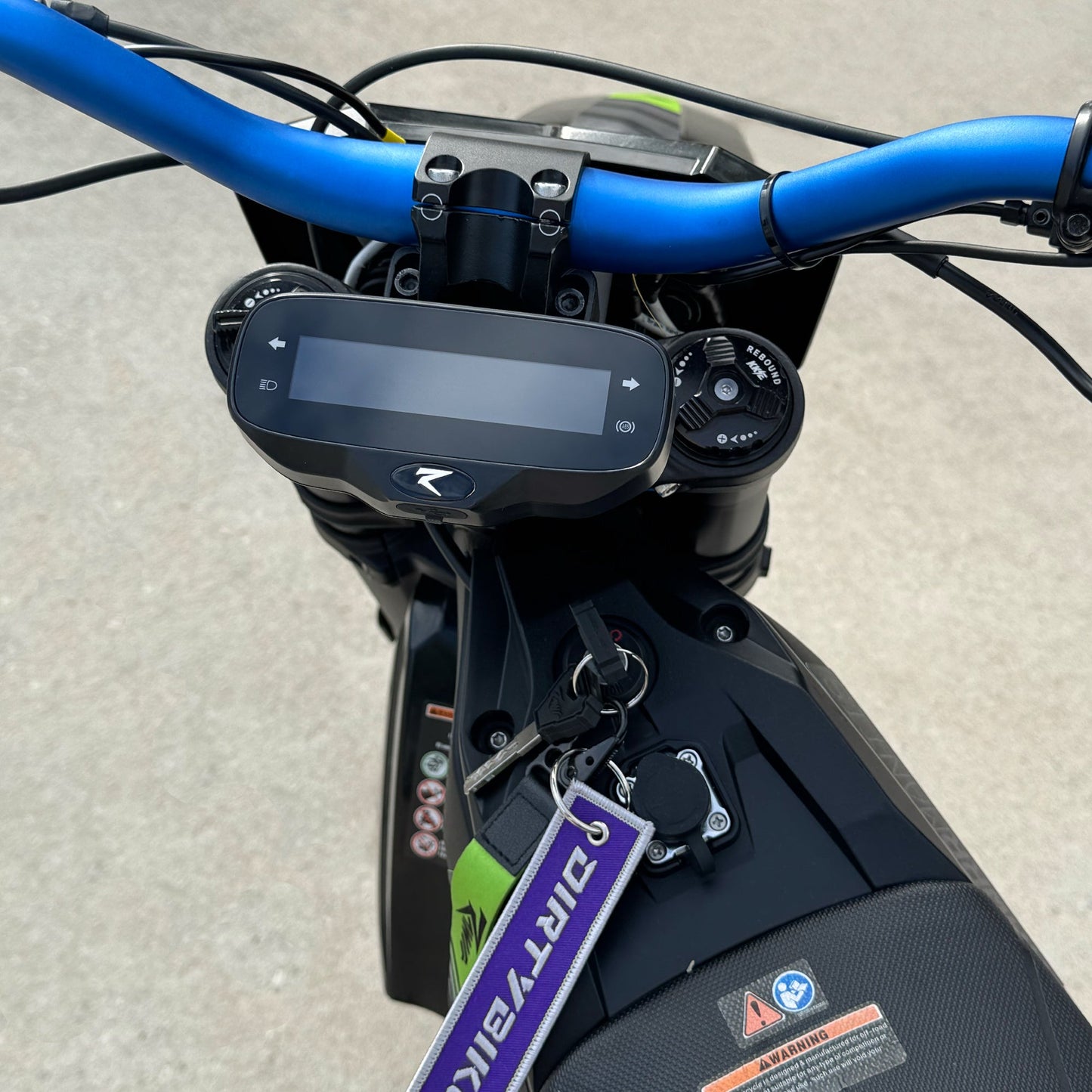 Rawrr Mantis X speedometer relocation bracket kit installed on eDirtyBike electric bike for secure display positioning.