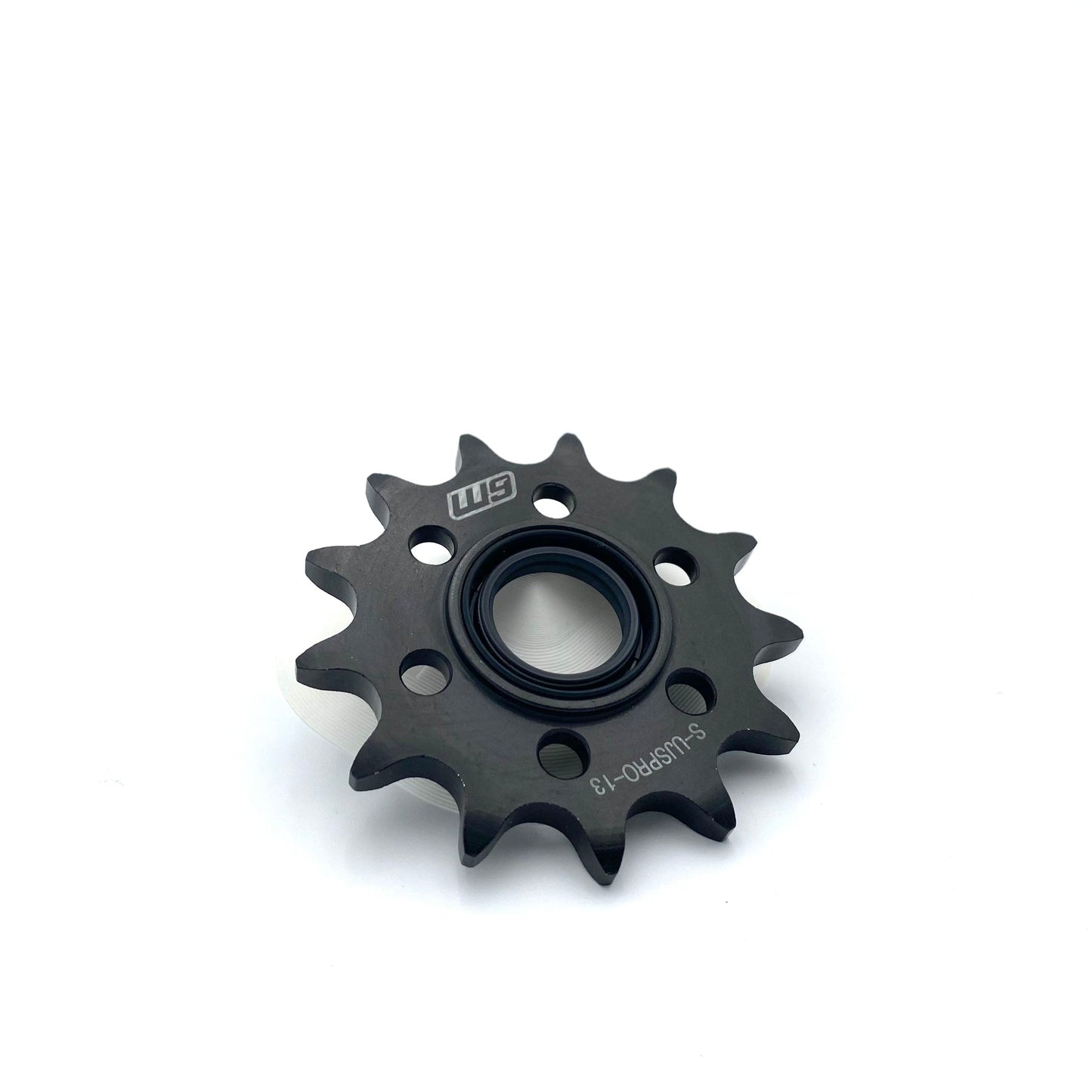 Warp9Racing Ultra Bee Jack Shaft Sprocket mounted on a bike, showcasing precision-machined steel construction for motorcycle drivetrain.
