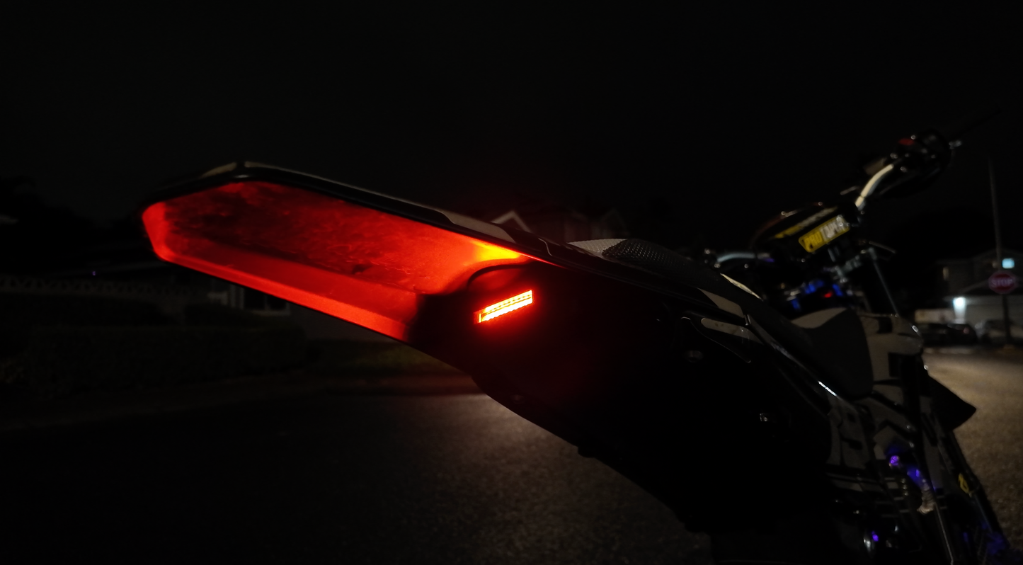 Project9 Ultra Bee non-functional tail light, black plastic with mounting bracket, designed for motorcycle safety and visibility.