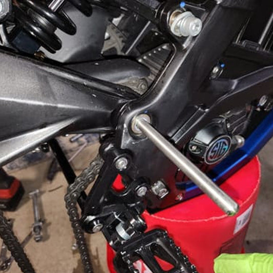 eDirtyBike Surron Light Bee DB mid shaft alignment tool in use, showing precision tool for e-bike motor alignment.