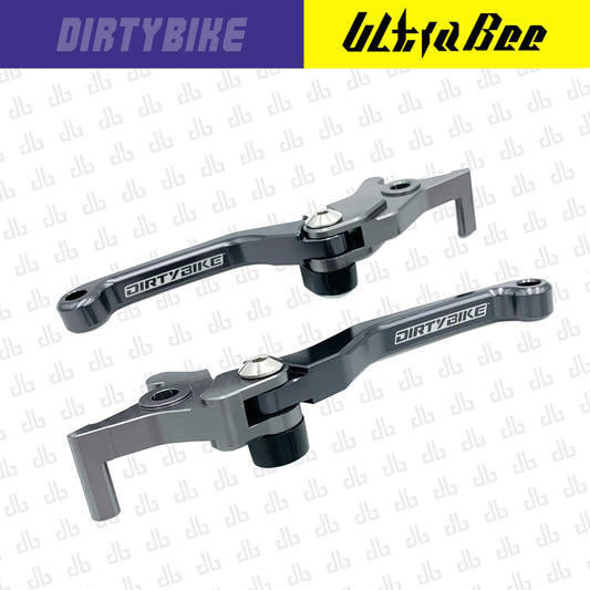 CNC aluminum folding brake lever set for Surron Ultra Bee electric bike, in graphite finish, by eDirtyBike.