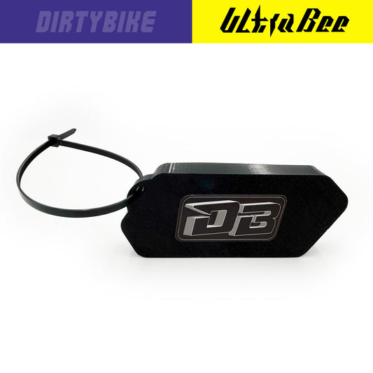 Black Gauge Protector Cover for Surron Ultra Bee by eDirtyBike, designed to shield the gauge from dirt and damage.