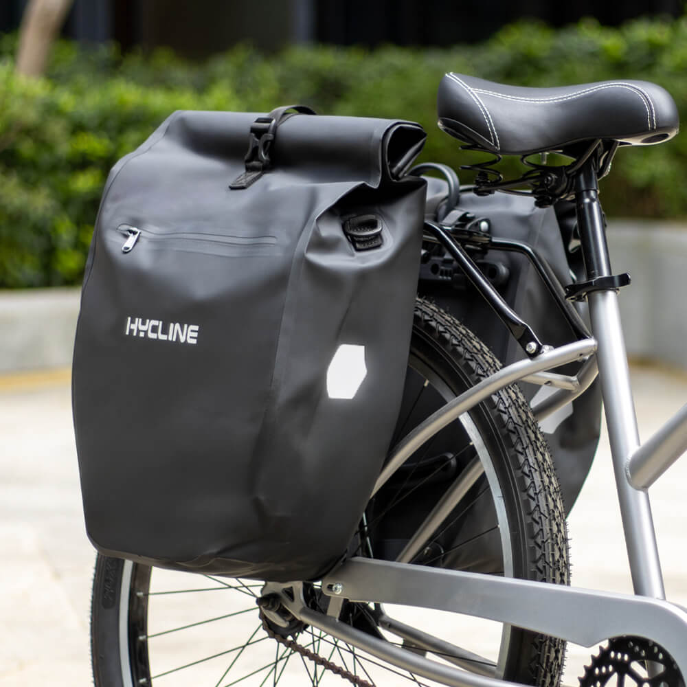 Hycline waterproof bike pannier bag attached to bicycle, durable and designed for secure storage during cycling adventures.