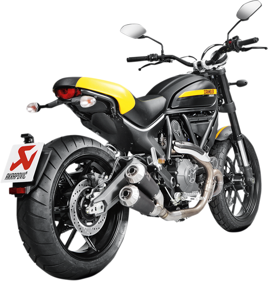 AKRAPOVIC titanium muffler for Ducati Scrambler motorcycle, shown with polished titanium finish and mounting details.