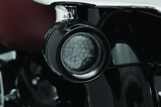 Kuryakyn Luminez LED front turn signal insert in amber for Harley-Davidson motorcycles, designed for 1157 bulb sockets.