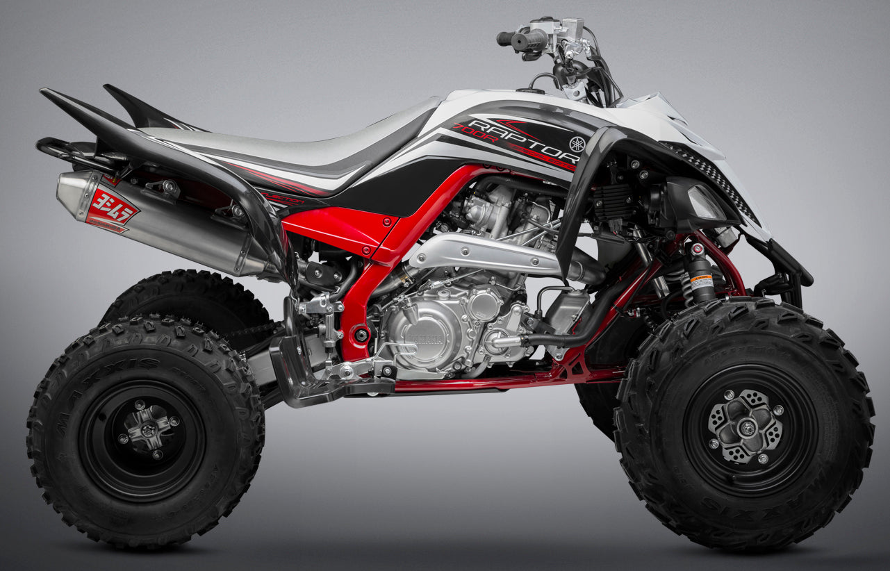YOSHIMURA Yoshimura Signature RS 2 full system exhaust for UTVs, showing the sleek black and silver metal design with branding details.