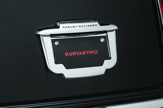 Chrome Kuryakyn license plate frame designed for trikes, featuring a sleek, polished finish and sturdy mounting for motorcycle customization.
