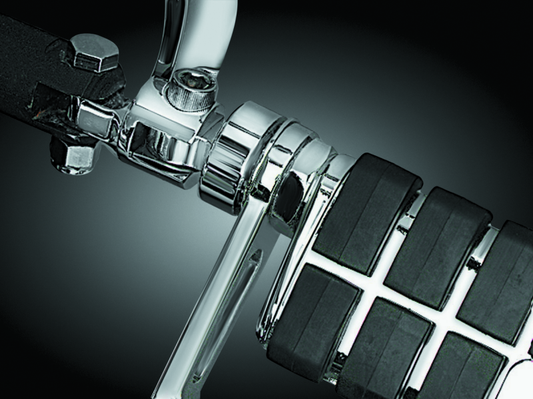 Chrome Kuryakyn 1-1/4 inch stirrup heel rest extenders for Harley-Davidson motorcycle footpegs.