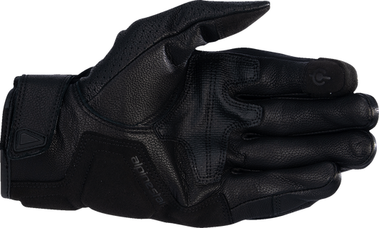 Black and white Alpinestars Celer V3 motorcycle gloves in medium size, featuring protective knuckles and adjustable wrist closure.