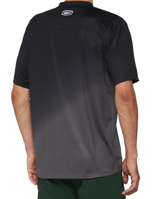 Black and charcoal short-sleeve 100% Celium Jersey by Bill's Exhausts, XL size, with sleek athletic fabric and branding details.