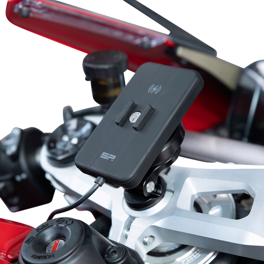 Bill's Exhausts SP CONNECT Wireless Charging Module for phones, showing the sleek charging device with a smartphone attached.