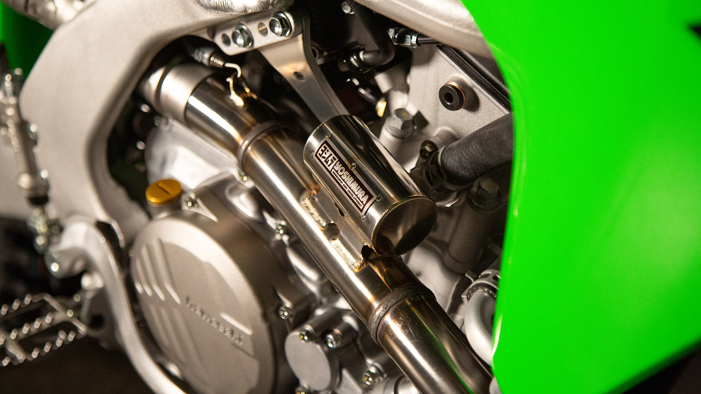 YOSHIMURA RS-12 exhaust system for Kawasaki KX250F motorcycle, showing the sleek titanium muffler and mounting hardware.
