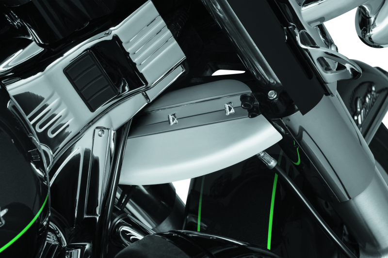 Kuryakyn chrome lower triple tree wind deflector installed on Harley Davidson Touring motorcycle, showcasing sleek finish and mounting hardware.
