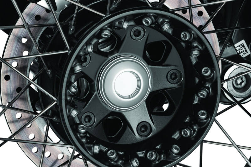 Kuryakyn Lodestar front axle sliders for BMW R1200GS and R Nine T, designed to protect suspension and brake components.