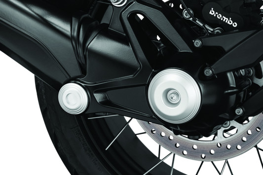 Kuryakyn Lodestar front axle sliders on BMW R1200GS and R Nine T protect suspension and brake components during falls or impacts.