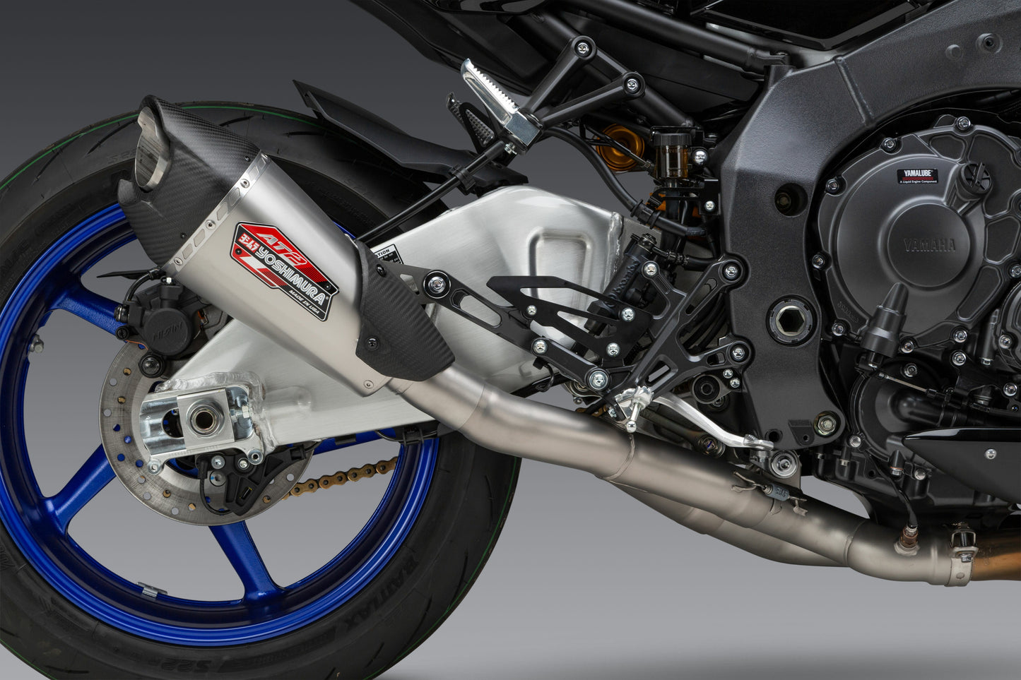 YOSHIMURA Yoshimura Exhaust Race AT2 3/4 stainless steel with carbon fiber end cap, showing polished metal and sleek design